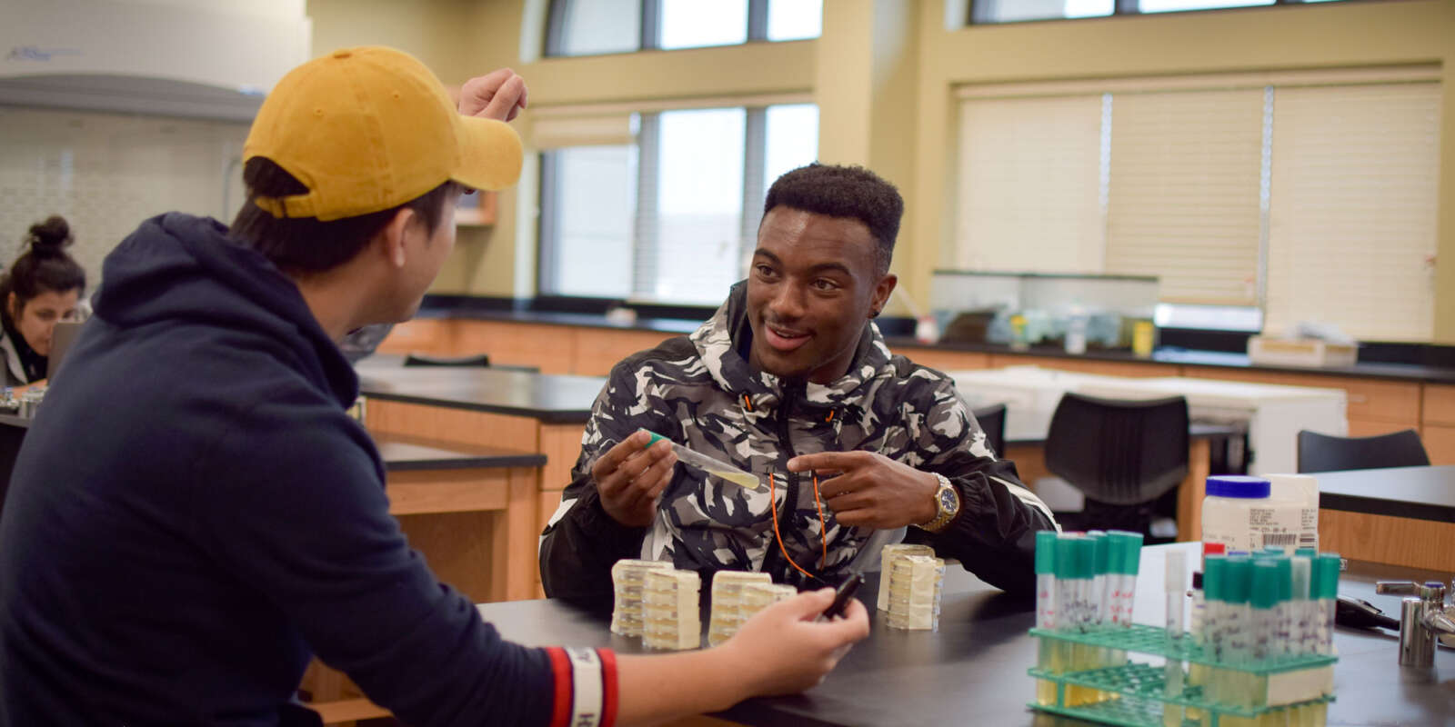 Two students work in a lab