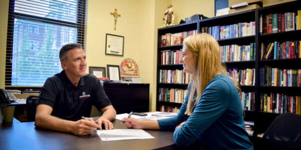A professor meets with a student