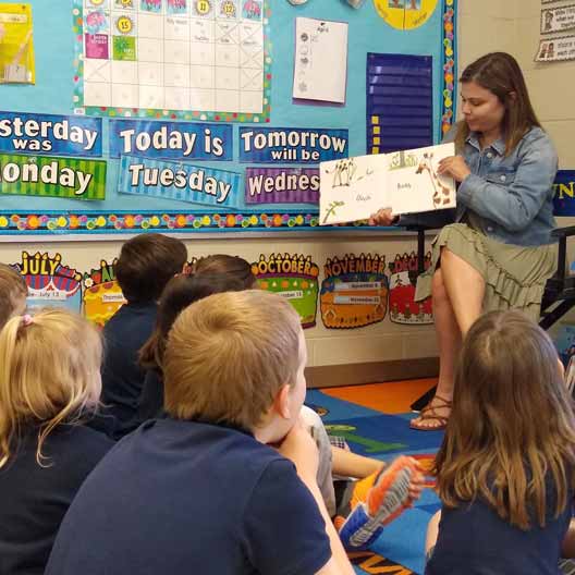 A student teaching class to children