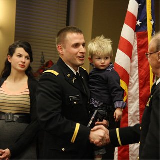 Men in uniform shaking hands
